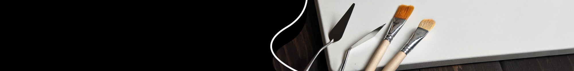 paint brushes and paint accessories on a table