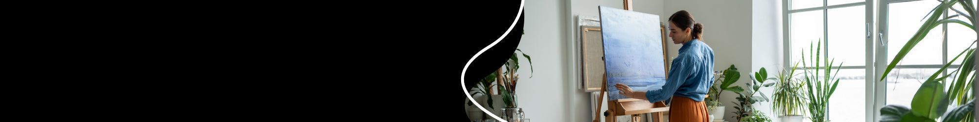 artist is painting on a canvas, put on a studio easel
